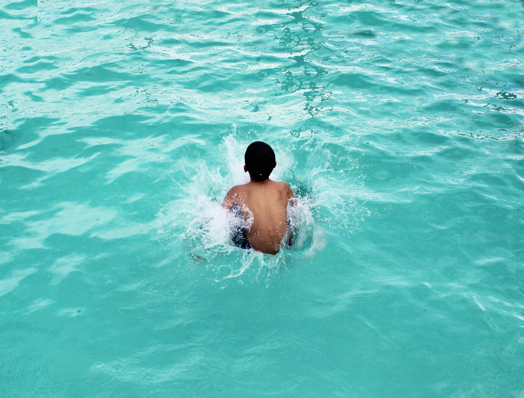 toddler in body of water